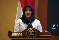 Eva Gantini, Kepala Pusat Penilaian Kompetensi (Kapuspenkom) BPSDM Hukum, saat membacakan sambutan Kepala BPSDM Hukum, Kementerian Hukum RI.